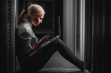 Young engineer businesswoman in server room
