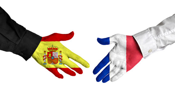 Spain and France leaders shaking hands on a deal agreement