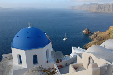 Fototapeta na wymiar Church with blue dome overlooking the Aegean