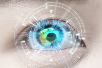 Close-up of woman's blue eye. High Technologies, contact lens, c