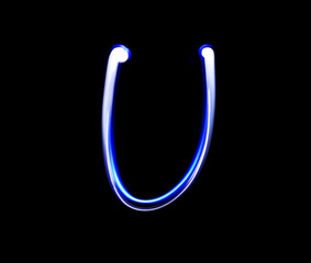 U Uniform alphabet hand writing blue light  over black backgroun
