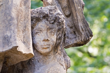 Fototapeta na wymiar Part of the street sculpture - the girl