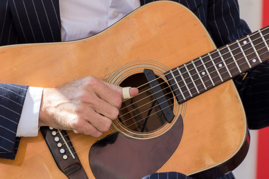 Guitar in the hands of a musician