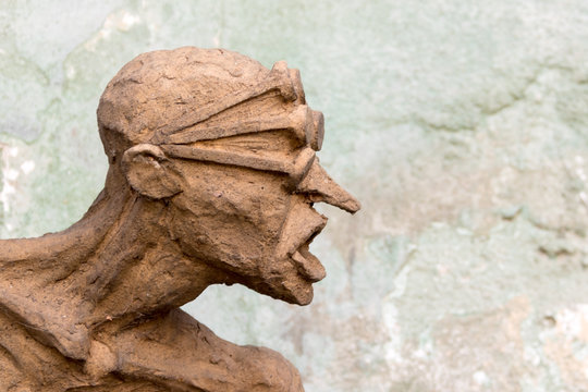 Sculpture of a naked man with a bald head
