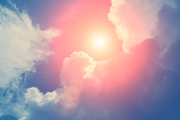 Fluffy clouds in the sky with sunlight