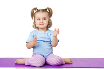 Little girl doing fitness exercises