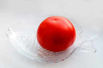 Tomato on a glass plate