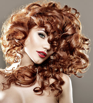 Long Curly Red Hair. Fashion Woman Portrait. Beauty Model Girl w