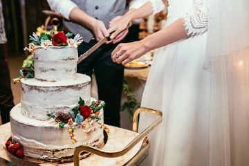 bride and groom cut rustic wedding cake on wedding banquet with - 101591527