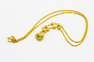 gold necklace on white background