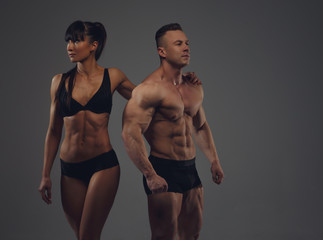Fototapeta na wymiar Bodybuilder and his girlfriend in underwear.