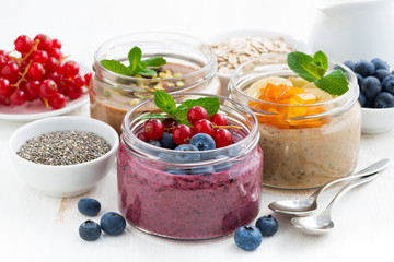 assorted breakfast of chia seeds and fruits in jars 