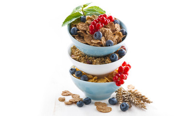 assortment of breakfast cereal and fresh berries, isolated