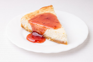 Piece of cheesecake on white saucer