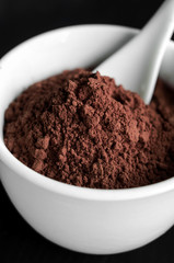 Cocoa powder in a bowl close up