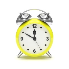 Yellow alarm clock on white