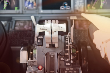Throttle levers, ready to go. Jet airliner cockpit.