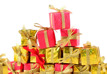 Golden and red gifts close-up on a white