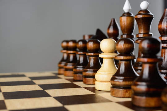The white pawn among black pieces