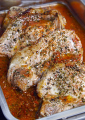 Pork chops withs sauce in a pan