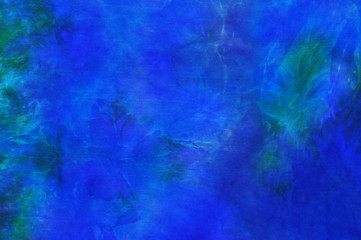 Fototapeta na wymiar Beautiful blue and green tie dye silk fabric background