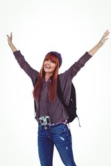 Obraz premium Smiling hipster woman with hands up