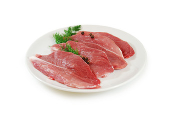 Raw Meat. Pork Steaks With Dill on a Dish Isolated against White Background