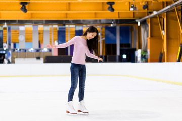 Woman on skating rink