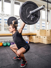 Young man lifting at a crossfit gym
