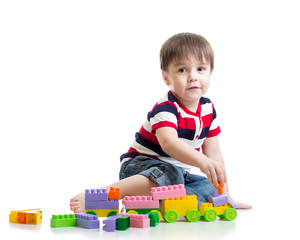 little child with construction set over white background