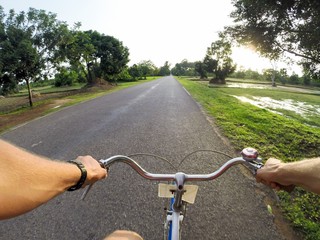 Fototapeta na wymiar Young man on the bicycle. Siem Reap, Cambodia.