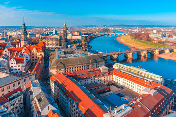 Aerial view over river Elbe with Augustus Bridge, Hofkirche, Royal Palace and roofs of old Dresden,...