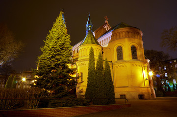 Fototapeta na wymiar Romanesque brick Catholic church at night in Poznan
