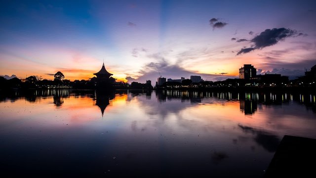 SARAWAK - DECEMBER 4: A 4K footage of beautiful sunrise with the background view of Dewan Undangan Negeri and Woterfront on December 4, 2015 in Sarawak.