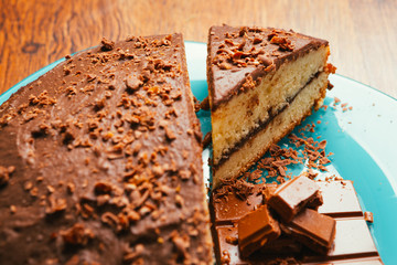 sweet cake and chocolate chips on a blue plate