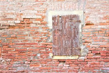 Closed window on a old wall with copy space