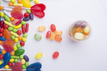 Fototapeta na wymiar Multicolor candies in glass jars