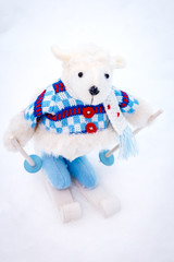 Fluffy cute soft toy sheep skiing