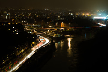 Fototapeta na wymiar View of Bristol from the Clifton Suspension Bridge. A night cityscape focused on the split of the River Avon, encircling the Cumberland Basin 
