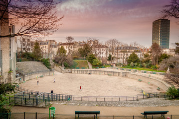 Winter in Paris inside the beautiful Latin Quarter and its Arenes de Lutece is nice when children play football when some century before, gladiators were fighting till death !