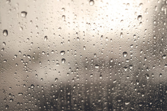 Rain water drops on a glass