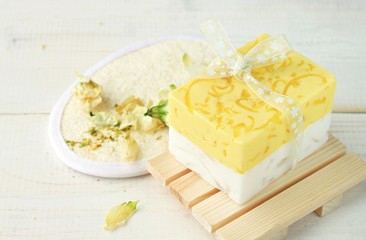 Herbal cleansing cosmetic products. Handcrafted soap bar, wooden bathroom accessories, loofah