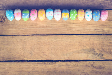 Easter eggs on wood background with Vintage tone.