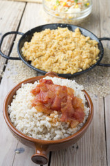 Different rice dishes (paella with vegetables, tomato and rice p