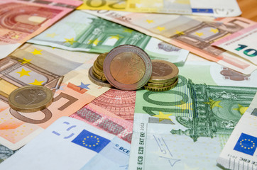 euro banknote with coins