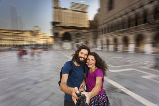 Cheerful tourists making selfie photo in Venice