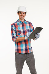 Handsome young engineer with clipboard.