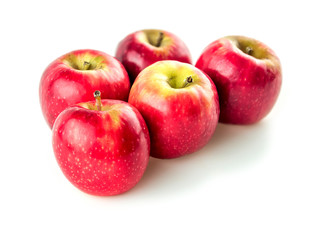 Five edible raw apples isolated on white