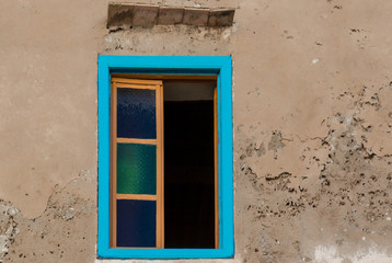 Fototapeta na wymiar Window with a blue frame