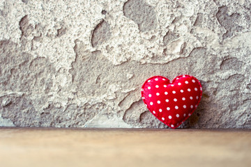 Red Heart on Wooden Floor With Retro Wall Background,Concept of Love,Valentines Day Background